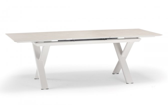 Aluminiowy stół ogrodowy SALINA beżowy nogami krzyżowe i rozkładany blat 200-260 cm kamienia spiekanego Salina