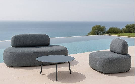 Zestaw wypoczynkowy złożony z sofy i fotela w o obłych kształtach antracytowy ROCK SET ze stolikiem