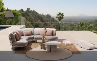 Modułowy aluminiowy narożnik ogrodowy o obłych kształtach Helios bizzotto konstrukcja antracyt poduszki szarobeżowe