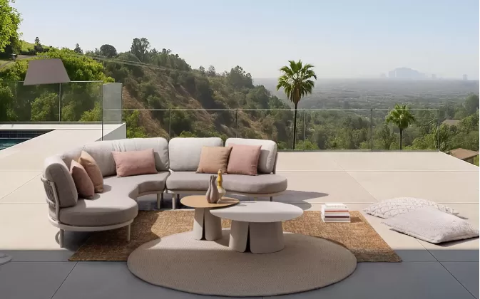 Modułowy aluminiowy narożnik ogrodowy o obłych kształtach Helios bizzotto konstrukcja antracyt poduszki szarobeżowe